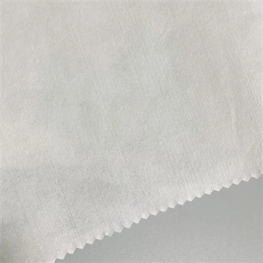 Spolbart nonwoven-tyg